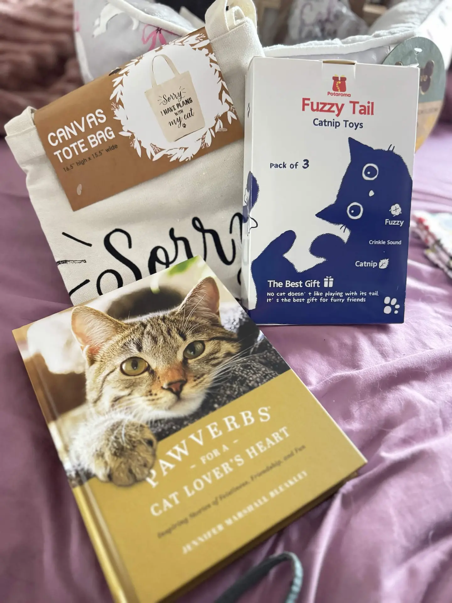 Canvas tote, catnip toys, and Pawverbs book